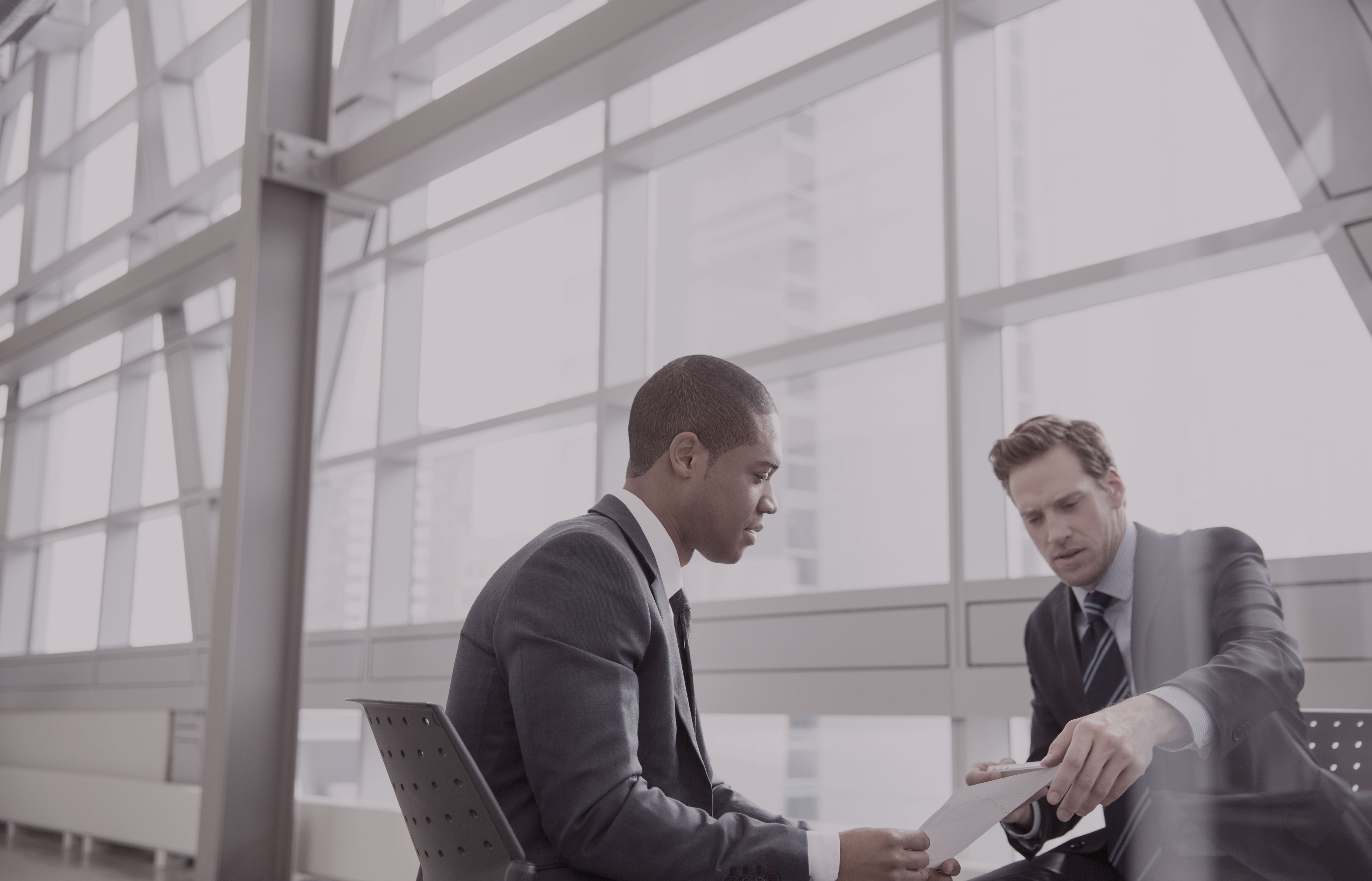 Professionals reviewing documents in a commercial office